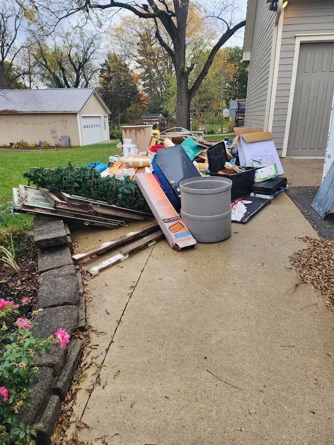 Dumpster being loaded with debris for Commercial Dumpster Rental in Pauls Valley